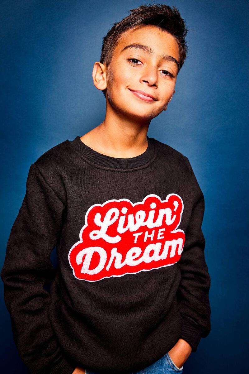 Layer in style in this Lola + The Boys Livin The Dream Sweatshirt! Wear this chic black crewneck out and about, or cozy up in it for a lazy day at home. Pair it with your fave denim or jogger to complete your style dream!