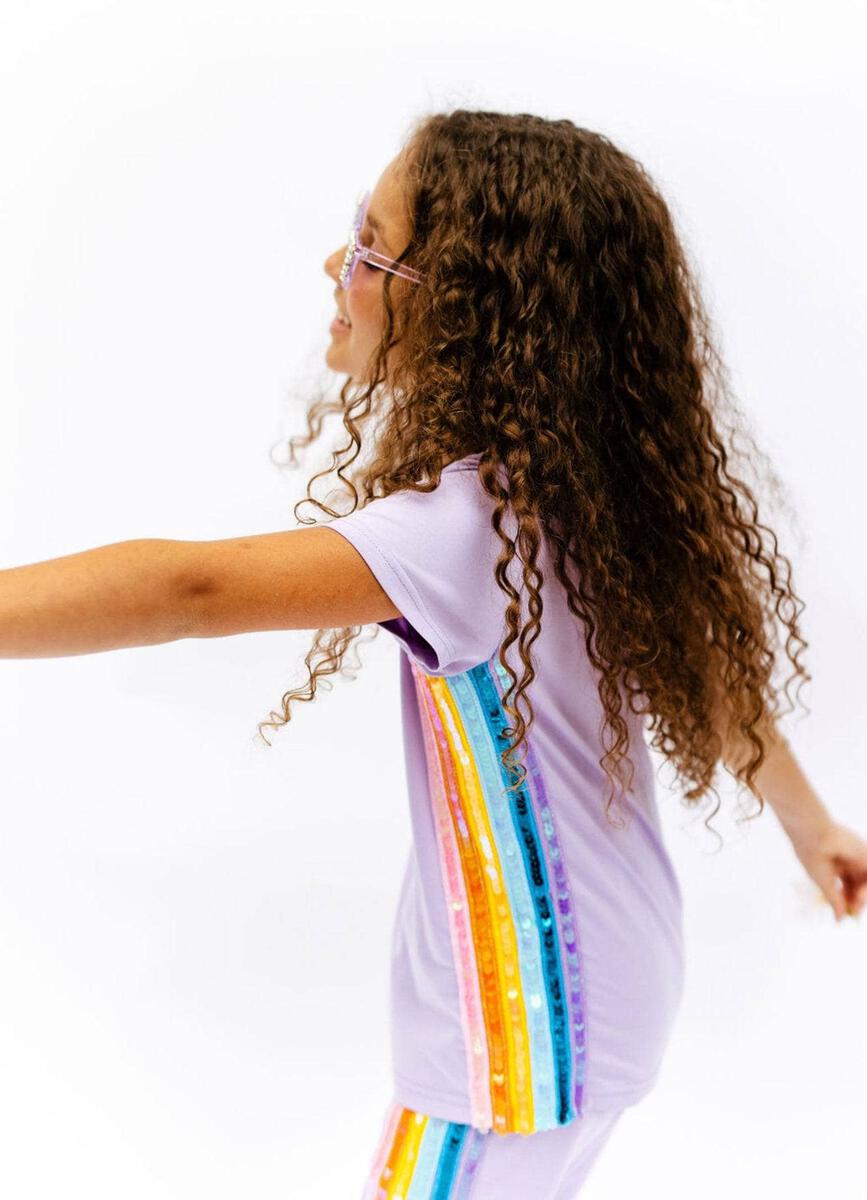 Lola + The Boys Lavender Rainbow Sequin Jogger Set. Dazzle them with this comfy and stylish set that will have them ready to take on the day in a trendy look. Includes soft, lightweight lavender tee and jogger with sequin rainbow aligning the sides. An easy go-to outfit that's sure to bring a smile and some serious sparkle!