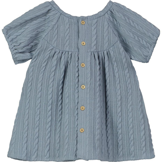 This Blue Keresen Dress is warm enough to carry through the season in style! Darling cable knit design and button-closure that can be worn in front or back.   95% polyester, 5% spandex. 