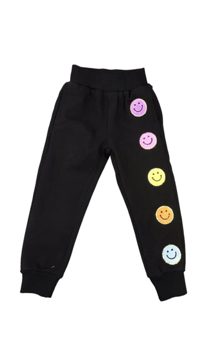These Lola + The Boys Smiley Emoji Black Joggers are a comfortable and cute staple that look great with any tee . Featuring an all-black design with bright, colorful emojis that are sure put a smile on your face!