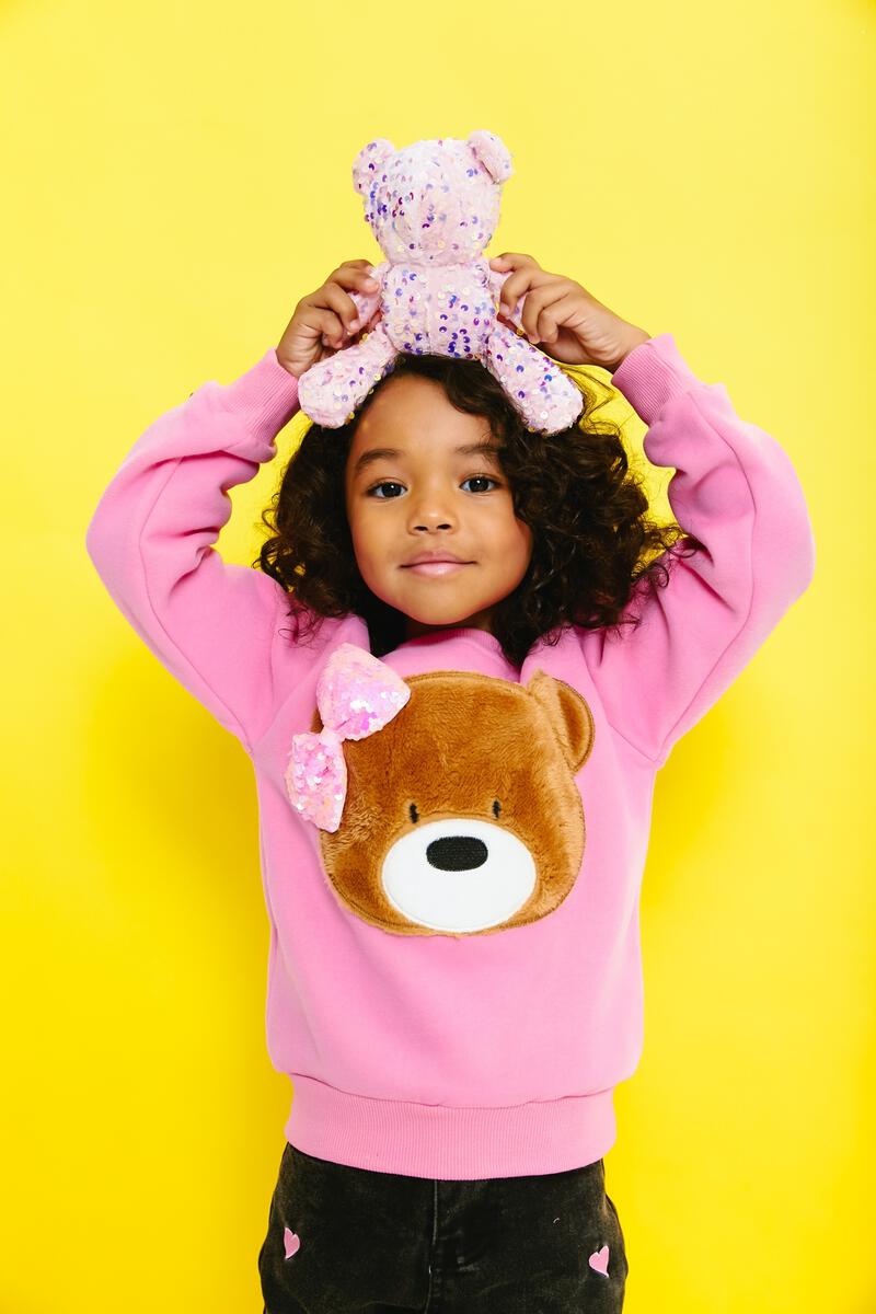 Look cute and cozy in this Lola + The Boys Teddy Bow Sweatshirt! This super soft crew neck sweatshirt features a plush teddy bear face with sequin bow, making it the perfect combination of sweet and stylish.