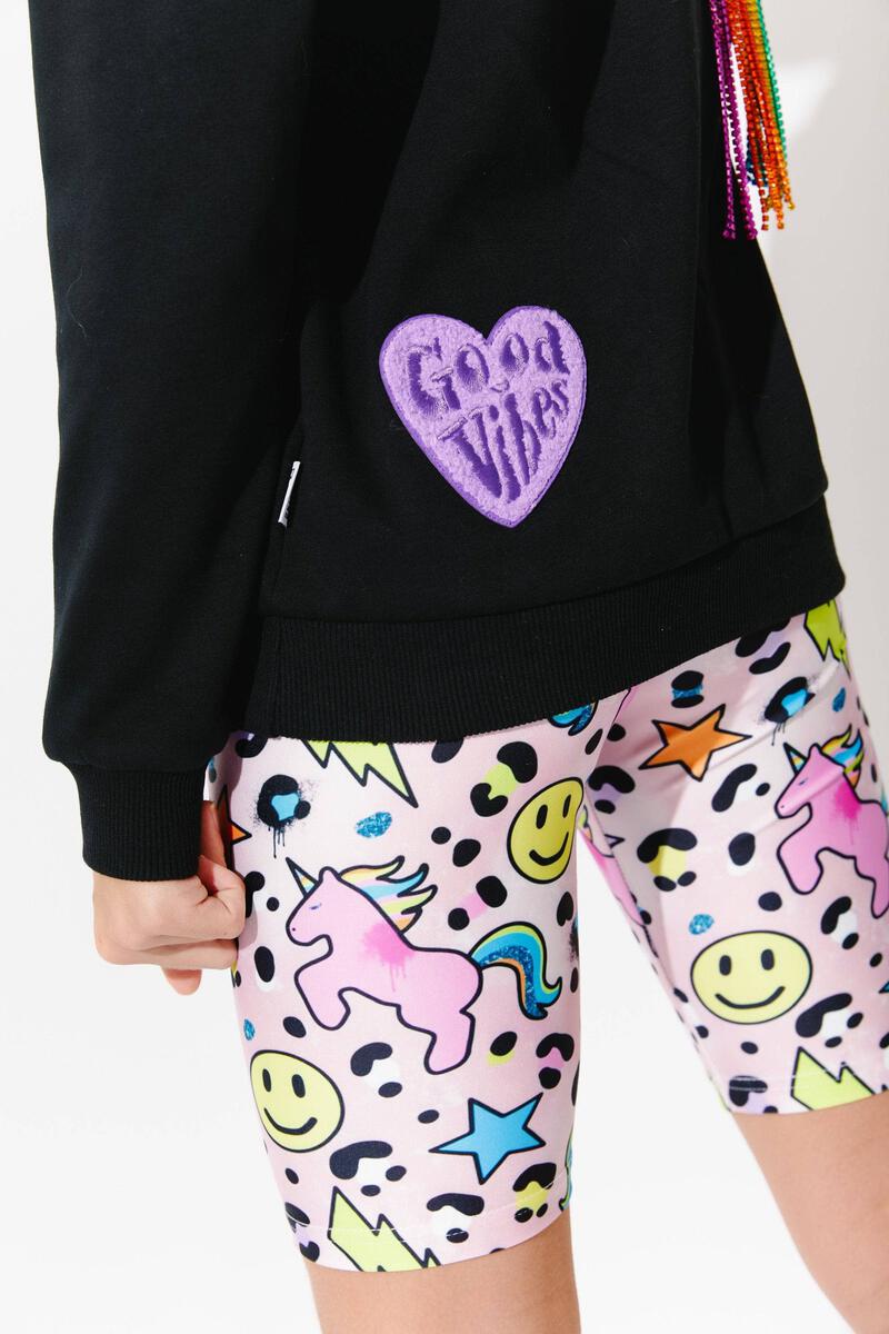 Lola + The Boys. Super comfy and stylish, these Lola + The Boys Happy Emoji Unicorn Biker Shorts pair perfectly with any top or tank - just add your favorite kicks and you're out the door! Jump on board and rock these rad biker shorts today!