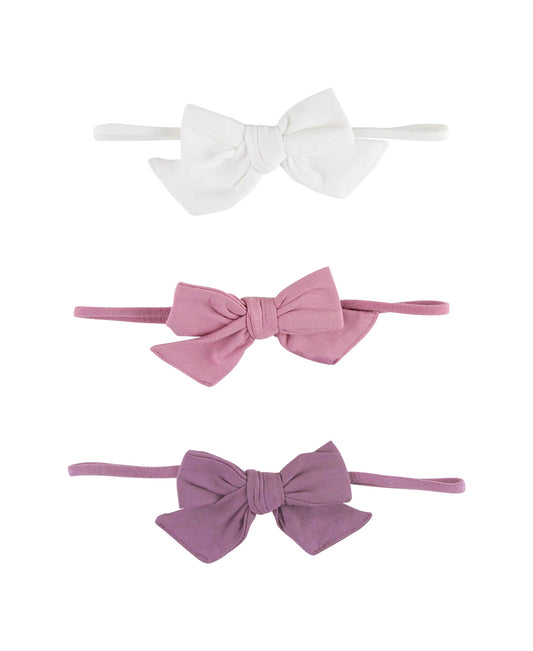 White + Violet + Mauve Bow Headband Set. These super-cute bow headbands are a wonderful addition to your little girl's accessory wardrobe. These stretchy headbands will keep the bow in place on even the busiest of littles! One size fits baby + toddler. 
