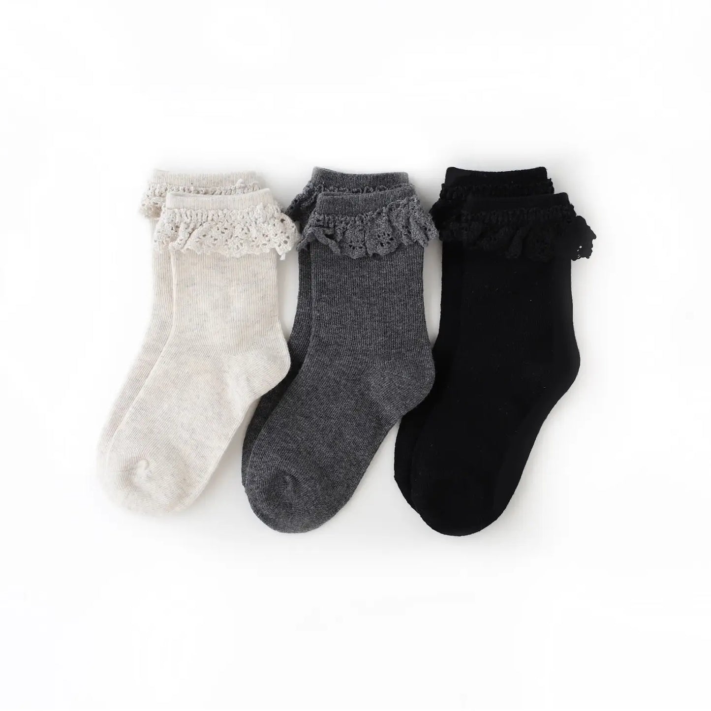 Midnight Lace Trim Midi 3 Pack includes 1 pair each of Black midi sock with matching black lace, Charcoal midi sock with matching charcoal lace, Heather Ivory midi sock with matching ivory lace. Our lace trim midi socks are intended to hit mid calf, between the ankle and knee. Machine wash cold with like colors. Tumble dry low or lay flat to dry. 76% cotton / 22% polyester / 2% spandex Women owned.