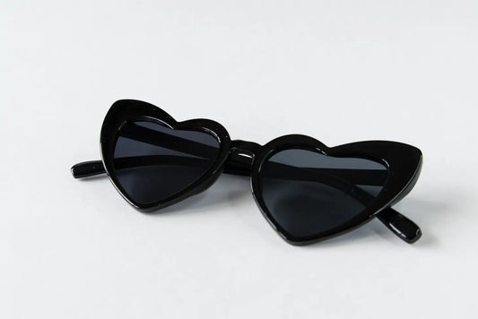 Black Retro Heart Sunglasses. This stylish design make these sunglasses a fun accessory for any child. Lightweight and comfortable to wear.   100% UV protection.  Women Owned.