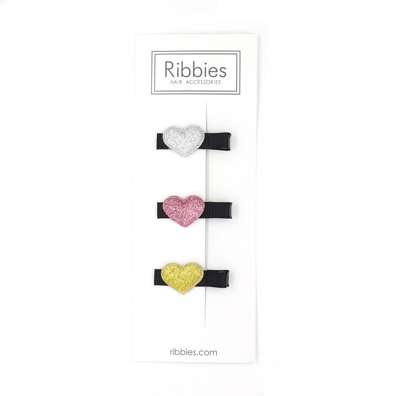 This set of 3 sparkly hearts on black hair clips is super cute and a great deal! The set includes one silver, one pink and one gold stars. All clips come with a hold tight foam grip that are perfect for fine hair.  Handmade. Women Owned. Eco-Friendly.