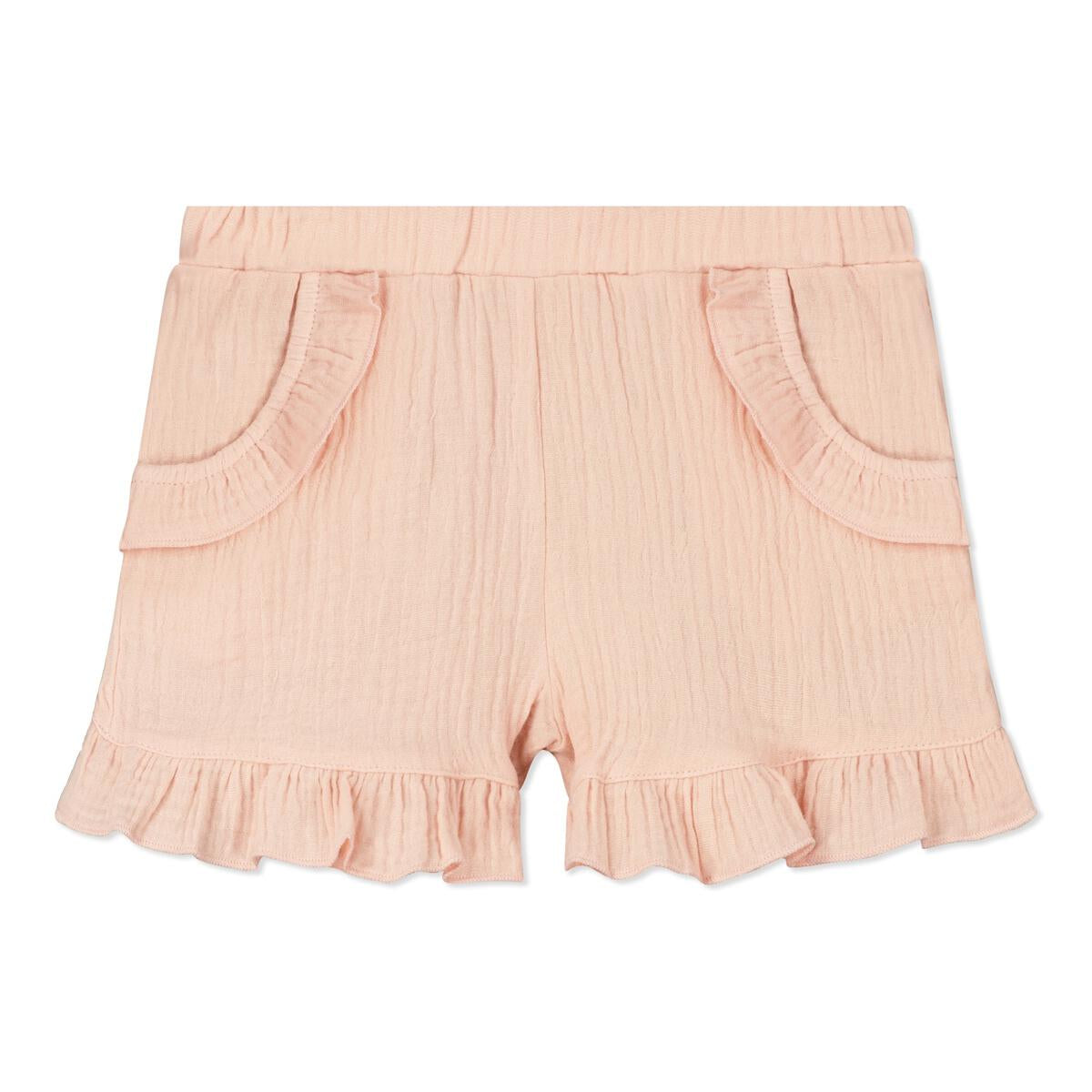 Pink Gauze Lyra Shorts. These shorts are a must have. Made with our lightweight gauze, these shorts have an elastic waist and adorable frill hem and pockets.