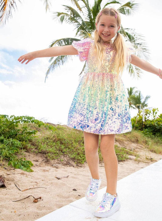 Dazzle in the Lola + The Boys Sequin Ombre Dress! This stunning dress features puff sleeves and an eye-catching ombre of sequins, so you can sparkle from day to night. Strut your stuff and make a statement in this shimmery showstopper!