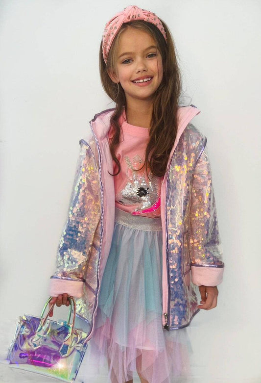 Lola + The Boys. Let your little one sparkle like a diamond in the rain with this Paillette Magic Rain Jacket from Lola + The Boys! With colorful and cute designs that'll glisten with each raindrop, this is the perfect jacket for any rainy day adventures. 