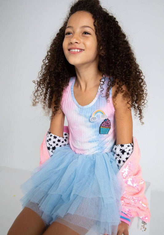 Lola + The Boys. Let your little one twirl and spin like the rainbow treat that they are with this Lola + The Boys Tie Dye Rainbow Cupcake Tutu Dress! A one-of-a-kind dress featuring a tie-dye cupcake patch and a blue tulle tutu, perfect for making a statement out and about or on the dance floor!