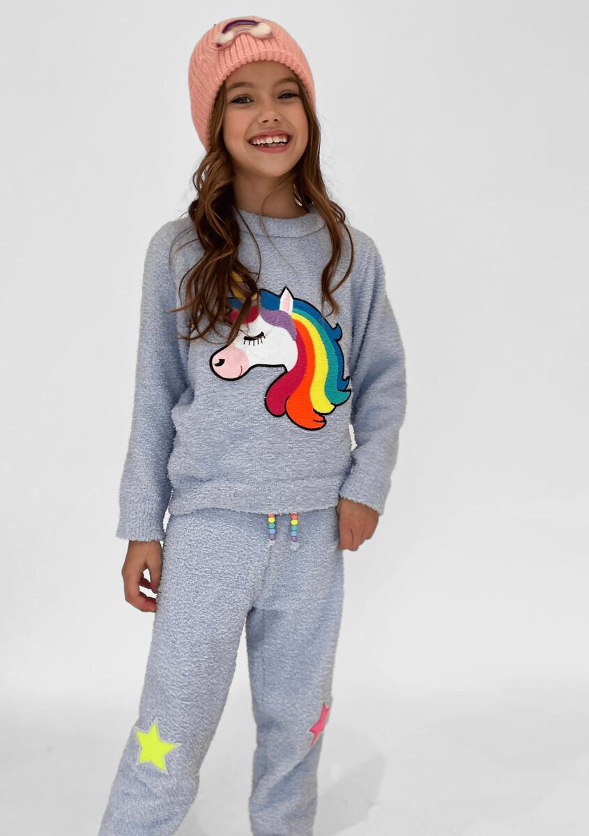 Stay cozy in this Lola + The Boys Fuzzy Unicorn Set! Includes a super cozy crew neck top with matching pant. Features unicorn and star appliqués and beaded tassel drawstring on pant. It's perfect for your unicorn lover!   100% Cotton. Machine washable. Tumble dry low. 