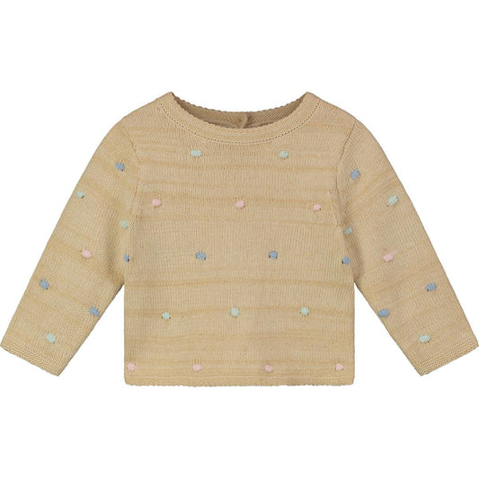 Stay cozy in our Oatmeal Dots Isolde Sweater. Gorgeous pastel polka dot knit sweater with button-back detail.  60% cotton, 40% acrylic. Machine wash cold. 
