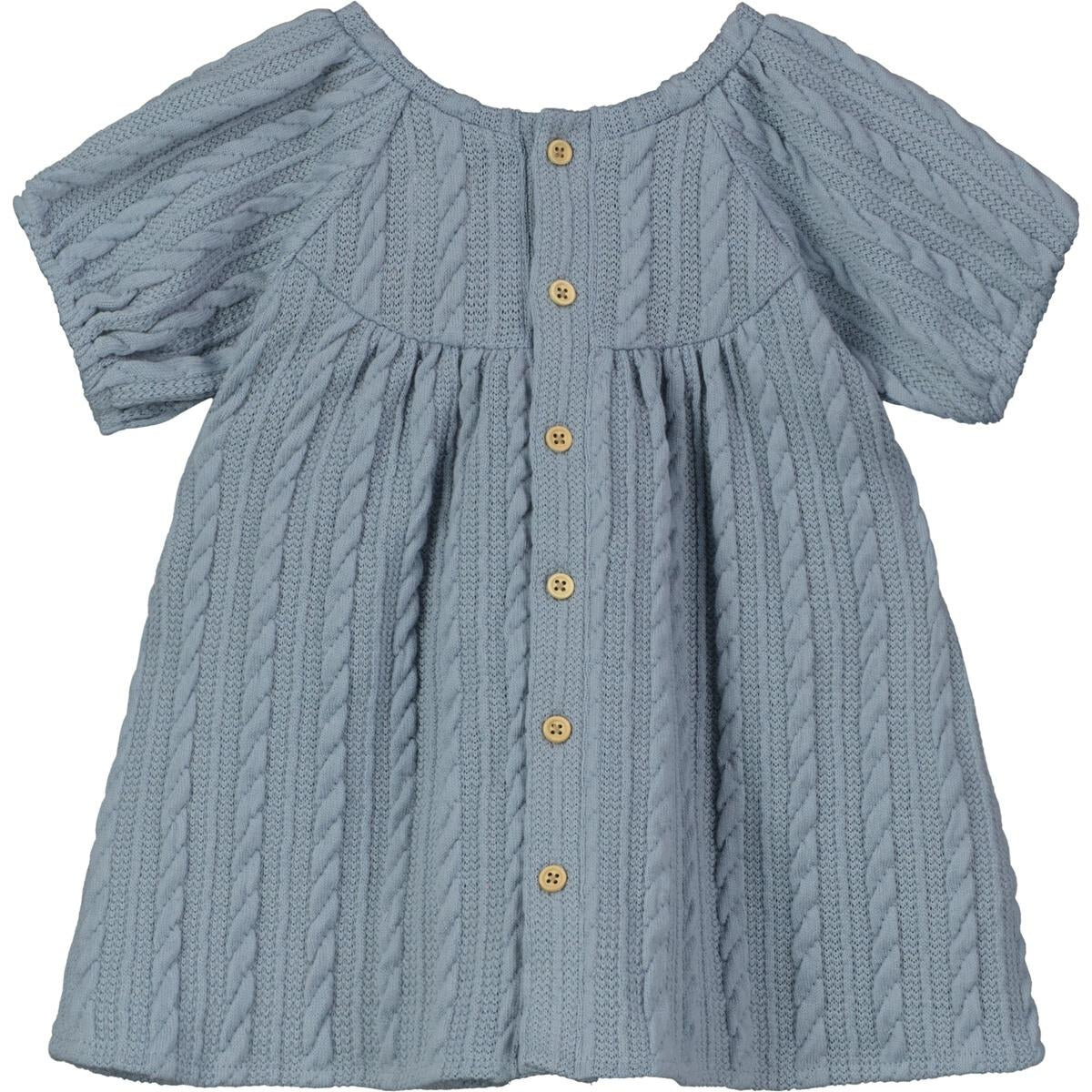 This Blue Keresen Dress is warm enough to carry through the season in style! Darling cable knit design and button-closure that can be worn in front or back.   95% polyester, 5% spandex. 