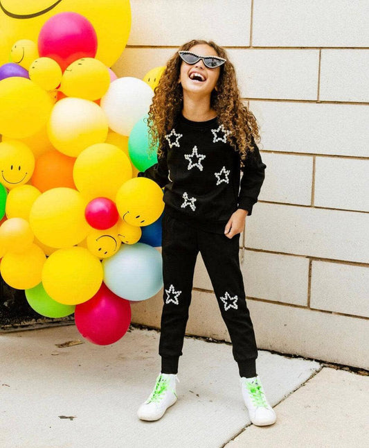 Chic + comfy in our Lola + The Boys Crystal Stars Set! Includes a black long sleeve crewneck and matching jogger with embellished star accents.   100% Cotton. Machine washable. Tumble dry low.