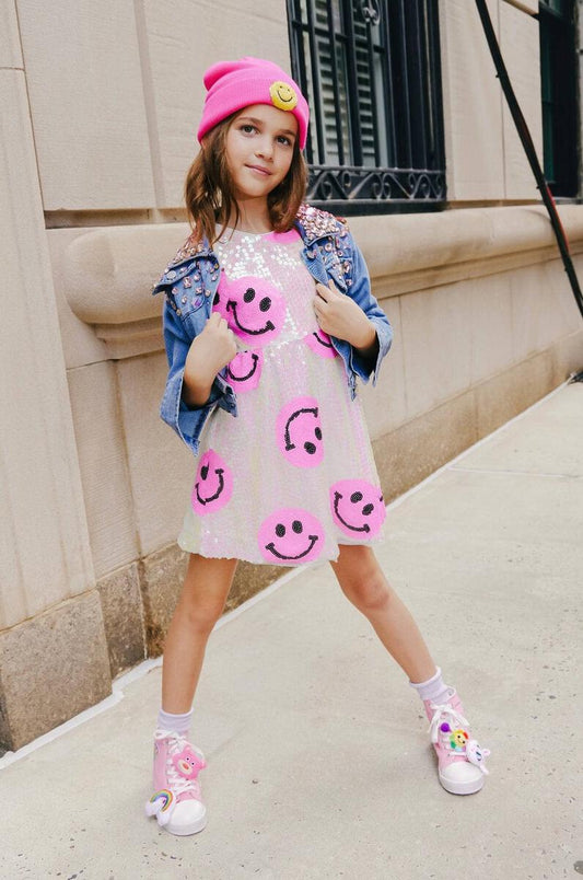 <p>Shine like the star you are in this Lola + The Boys Pinkie Happy Emoji Dress! Covered in pink smiley faces, this trendy yet cute dress will have you radiating sparkles! Strike a pose and unleash your inner fashionista!</p> <p>Gentle wash cold, hang or lay flat to dry.&nbsp;</p>