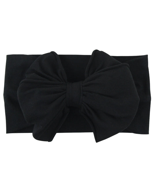 Complete your little's adorable ensemble with our Black Big Bow Headband. Crafted with care and attention to detail, this headband features a large, beautiful bow that adds a touch of sweetness to any hairstyle. Made from soft and stretchy fabric, it ensures a comfortable fit while effortlessly elevating her look with a dose of cuteness.  One size fits baby + toddler. 