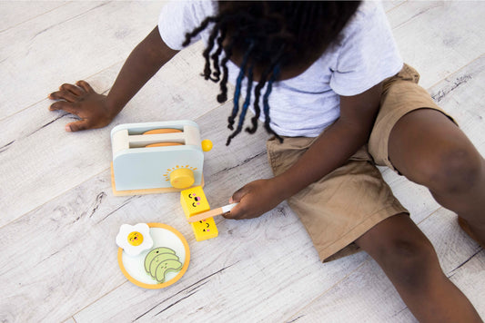 Created to Spark Curiosity. Encourage hours of imaginative play, skill development, and social interaction. Watch your little chef make a balanced breakfast with this thoughtfully designed wooden brunch time toaster set. 
