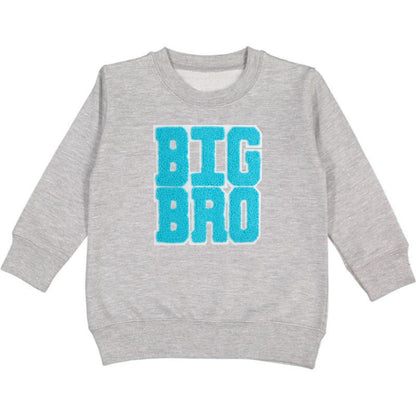 This Sweet Wink Big Bro Patch Sweatshirt is a fun and cute sweatshirt for any big brother! Features grey crewneck with blue chenille patch letters. Tagless inside neck label for itch-free wear. Toddler Unisex fit. Each sweatshirt is hand pressed with love.  60% Cotton, 40% Polyester Fleece.  Machine washable; wash inside out, lay flat to dry.   Women owned, mama owned. 