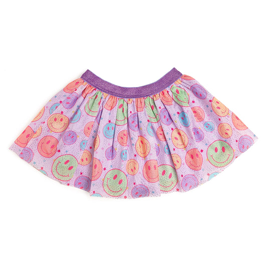 This Sweet Wink Smiley Face Tutu is a fun skirt and dress up tutu to welcome Spring! Features super soft lavender tulle printed with a smiley face pattern accented with purple glitter pin dots. Lavender cotton lining for added coverage and comfort. Non-shed purple glitter waistband.  Hand wash and line dry.  Women owned, mama owned. 
