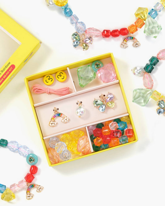 Add a little extra magic to your celebrations with this Make It Rainbow Mini Bead Kit! This super collectible kit includes a vibrant assortment of rainbow-hued gems plus three special charms—a butterfly to show off your inner magic, a gem pearl for strength and wisdom, and a rainbow to remind you of endless possibilities! Unleash your unique creativity and make it your own!  Small parts, not intended for children under 3 years.
