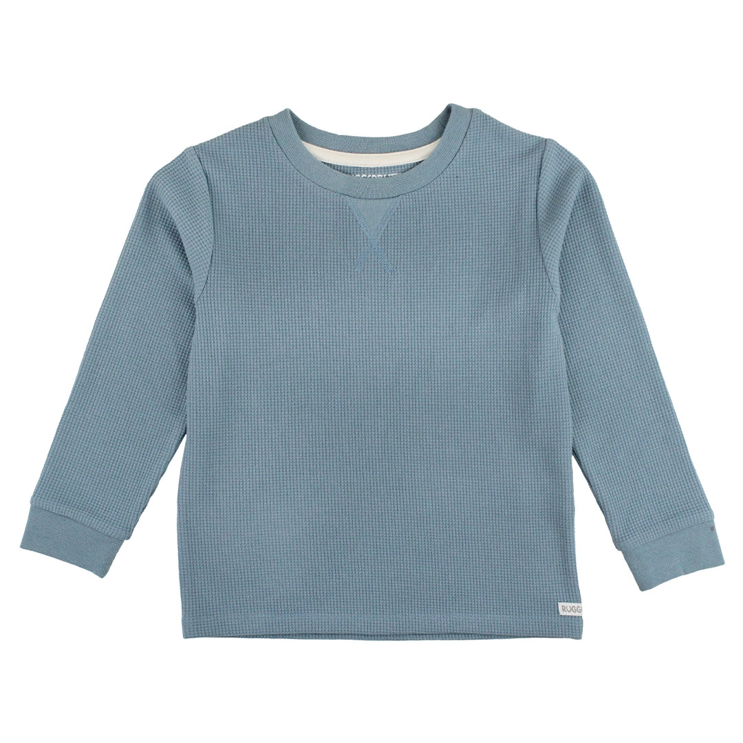 This Slate Waffle Knit Long Sleeve Shirt is a stylish essential for the cooler seasons. Made from waffle knit fabric, this shirt provides warmth without compromising comfort. Its classic crew neck design and long sleeves make it a versatile option for layering or wearing on its own, ensuring your little one stays both comfortable and fashionable!  Machine Washable.  63% Polyester, 34% Viscose, 3% Spandex. 