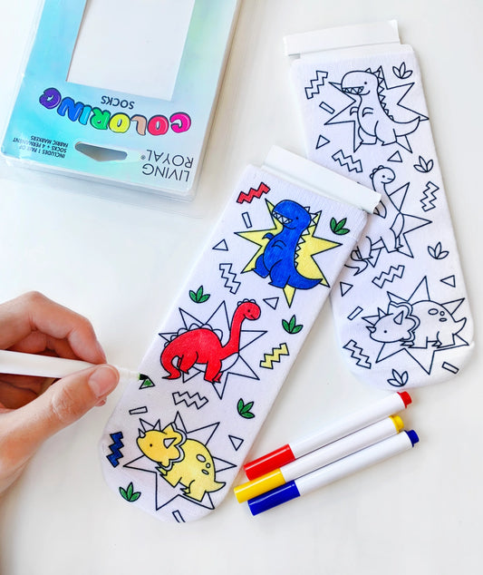 <p><span data-mce-fragment="1">Color your way with our Dino Daze Coloring Socks! </span></p> <p><span data-mce-fragment="1">Pack includes 1 pair of&nbsp;coloring ankle&nbsp;socks + 4 permanent fabric markers (colors may vary).</span></p> <p><span data-mce-fragment="1">ONE SIZE FITS MOST(child age 4+ through women size 11).&nbsp;</span></p> <p><span data-mce-fragment="1">Machine washable.</span></p>