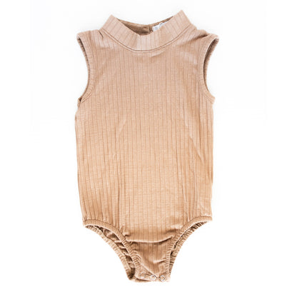 Your favorite Maple High Neck Ribbed Bodysuit is back! With a high neck and a ribbed fabric, it's a go-to layer all year. Pair it with a cute mini skirt or a pair of our bell bottoms to really make a statement this season! 93% Rayon, 7% Spandex.  Machine Wash Cold, Lay Flat To Dry.  Women Owned.